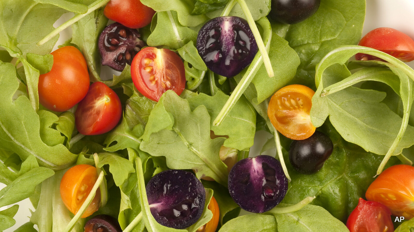 This image provided by The John Innes Centre, UK, shows a salad made with red and purple tomatoes.