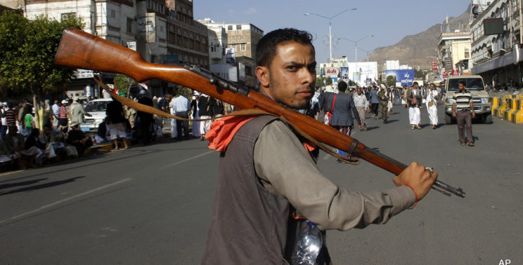 A Houthi Shiite rebel carries his weapon as he joins others to protest against Saudi-led airstrikes, during a rally in Sanaa, Yemen, April 1, 2015. . (AP/Hani Mohammed)