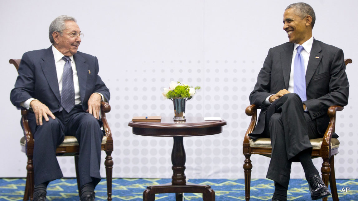 US President Barack Obama, right, smiles as he looks over towards Cuban President Raul Castro, left, during their meeting at the Summit of the Americas in Panama City, Panama, Saturday, April 11, 2015.