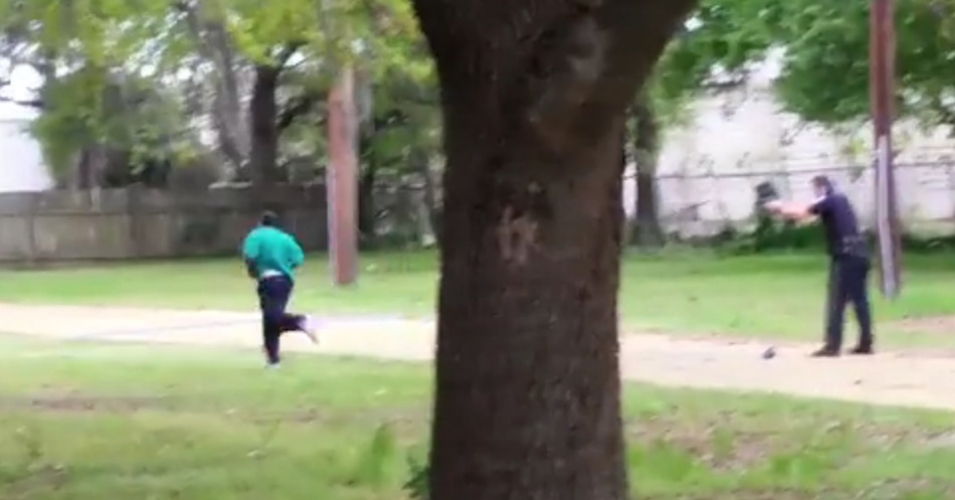 Screenshot from the by-stander's video footage which shows Officer Michael Scott in the process of shooting a fleeing Walter Scott in the back.