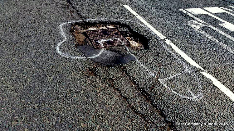 In Manchester, England, an activist has taken to the streets to get potholes fixed.