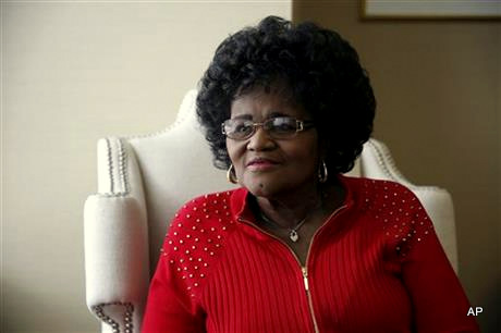 In this April 29, 2015 photo, Zella Jackson Price poses for a photo at her attorney’s office in Clayton, Mo. Eighteen black women who were told decades ago that their babies had died soon after birth at a St. Louis hospital now wonder if the infants were taken away by hospital officials to be raised by other families. The suspicions arose from the story of Price, who was 26 in 1965 when she gave birth at Homer G. Phillips Hospital and was told hours later that her daughter had died.