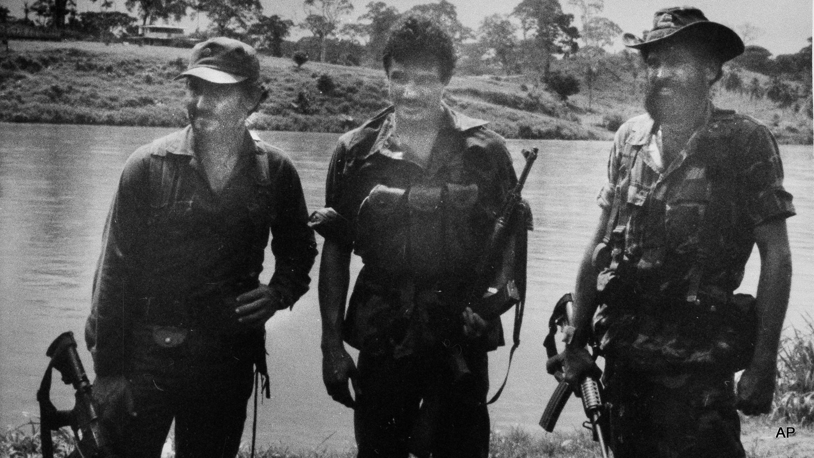 U.S. backed Nicaraguan rebel leader stands with guerrilla fighters with  in their camp in southern Nicaragua, 1983.  The rebel, trained, armed and funded by the CIA, formerd to overthrow the Nicaraguan Sandinista government. 