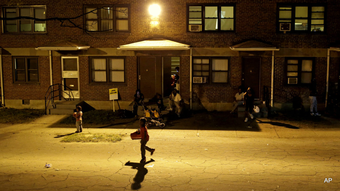 Children play at a party at the public housing complex where Freddie Gray was arrested as a six-day curfew was lifted, Sunday, May 3, 2015, in Baltimore. (AP Photo/Patrick Semansky)
