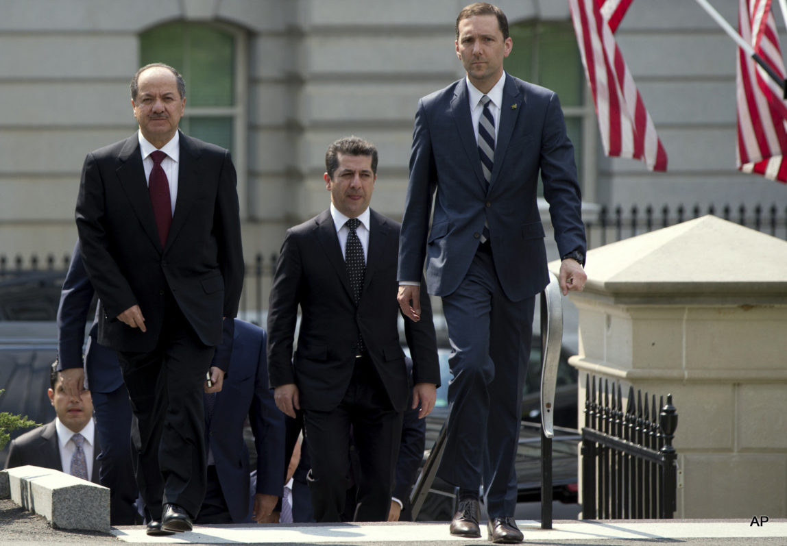 Iraqi Kurdistan Regional President Masoud Barzani, left, walks to West Wing of the White House in Washington, Tuesday, May 5, 2015, where he is scheduled to meet with Vice President Joe Biden.