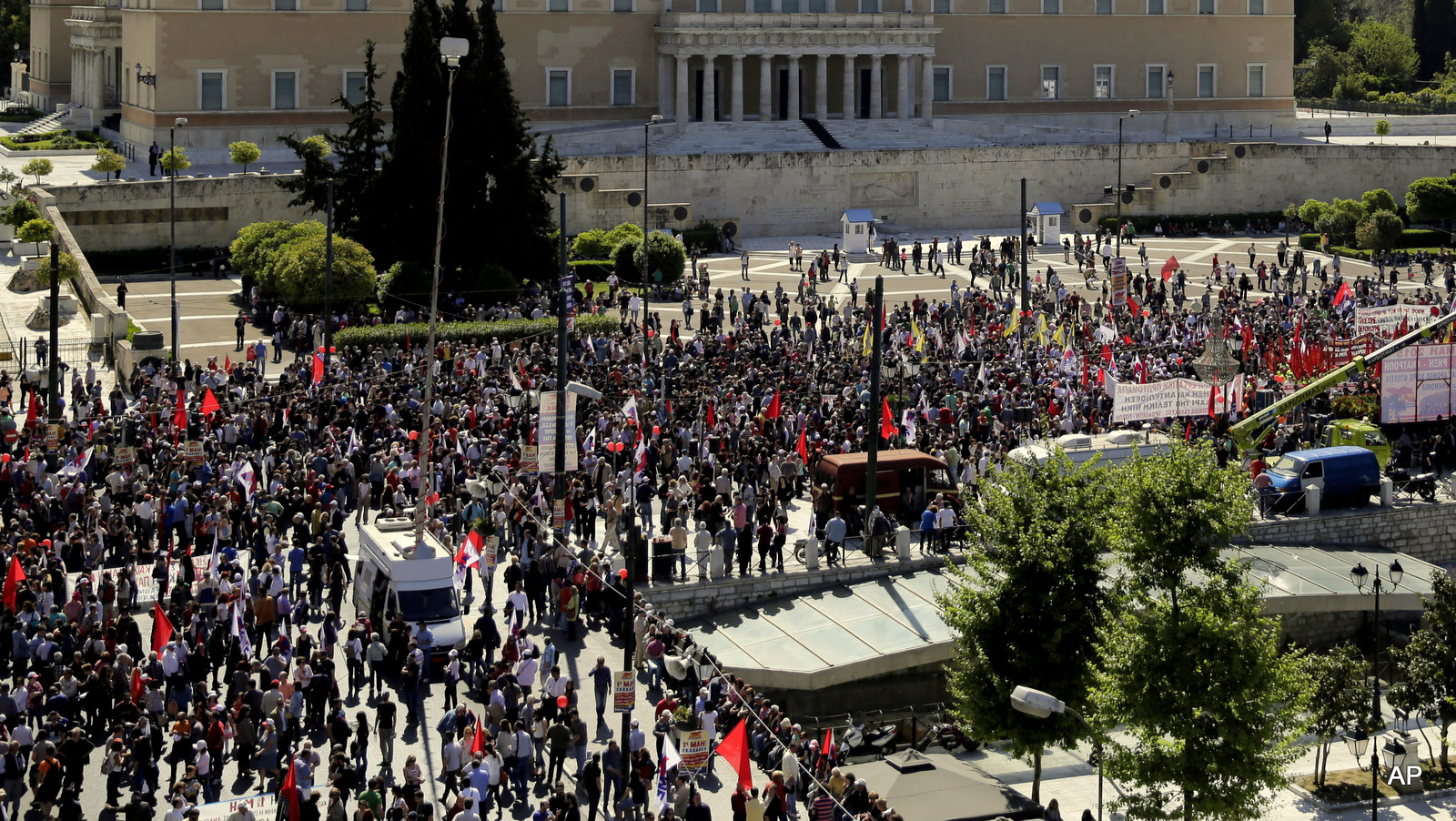 Protestrers take part in a May Day rally  in central Athens, on Friday, May 1, 2015. In financially struggling Greece, an estimated 13,000 people took part in three separate May Day marches in Athens, carrying banners and shouting anti-austerity slogans. 