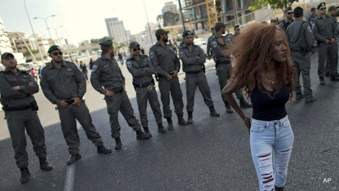 Israel's Jewish Ethiopians block highway during a protest against racism and police brutality in Tel Aviv, Israel, Sunday, May 3, 2015. Several thousand people, mostly from Israel's Jewish Ethiopian minority, protested in Tel Aviv against racism and police brutality on Sunday shutting down a major highway and scuffling with police.