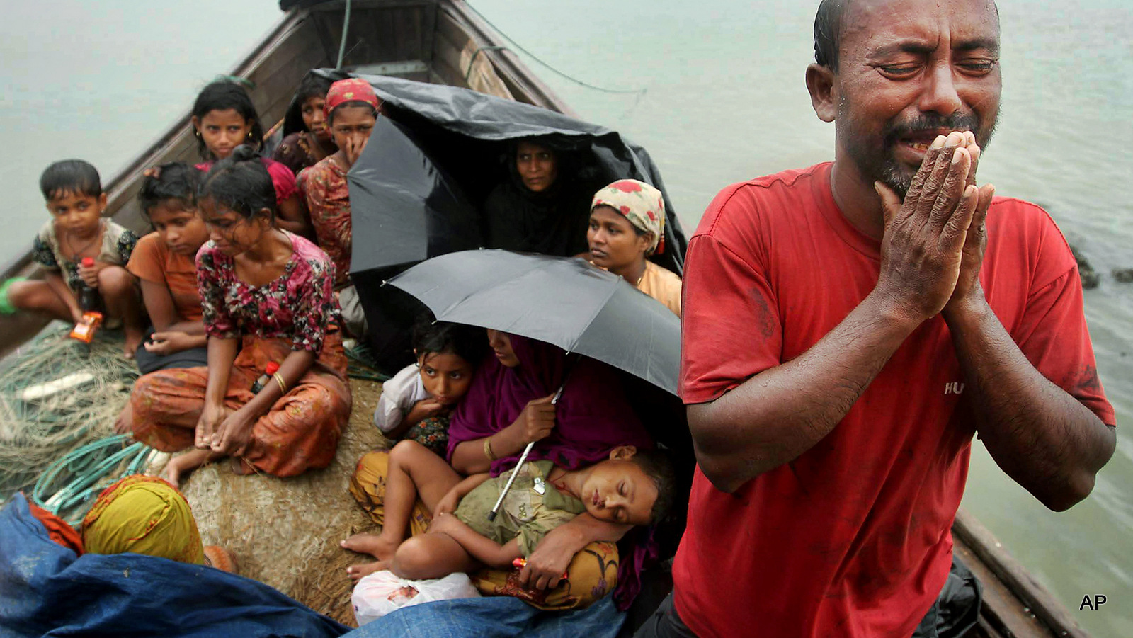 A Rohingya Muslim man who fled Myanmar to Bangladesh to escape religious violence, cries as he pleads from a boat after he and others were intercepted by Bangladeshi border authorities in Taknaf, Bangladesh. Two recent shipwrecks in the Mediterranean Sea believed to have taken the lives of as many as 1,300 asylum seekers and migrants has highlighted the escalating flow of people fleeing persecution, war and economic difficulties in their homelands.