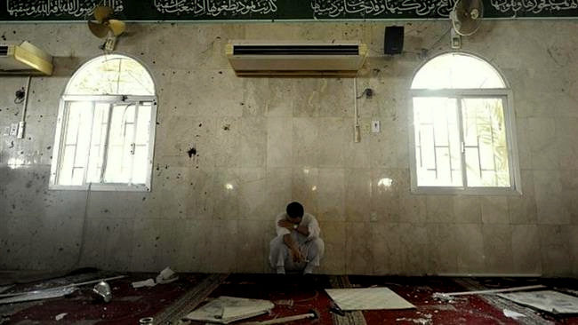 The photo sh the aftermath of a bomb attack at Imam Ali (PBUH) Mosque in the village of al-Qadeeh, Saudi Arabiaows the aftermath of a bomb attack at Imam Ali (PBUH) Mosque in the village of al-Qadeeh, Saudi Arabia, May 22, 2015. (© Al-Riyadh newspaper)