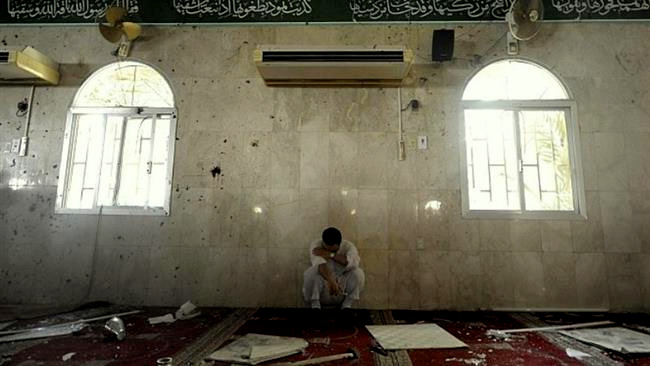 The photo sh the aftermath of a bomb attack at Imam Ali (PBUH) Mosque in the village of al-Qadeeh, Saudi Arabiaows the aftermath of a bomb attack at Imam Ali (PBUH) Mosque in the village of al-Qadeeh, Saudi Arabia, May 22, 2015. (© Al-Riyadh newspaper)