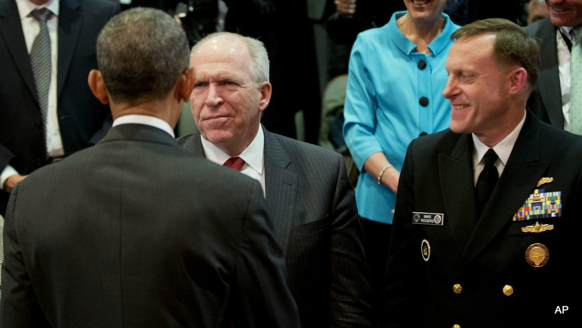President Obama greets CIA Director John O. Brennan, center, and Navy Adm. Michael S. Rogers, director of the National Security Agency, in McLean, Va., on April 24.