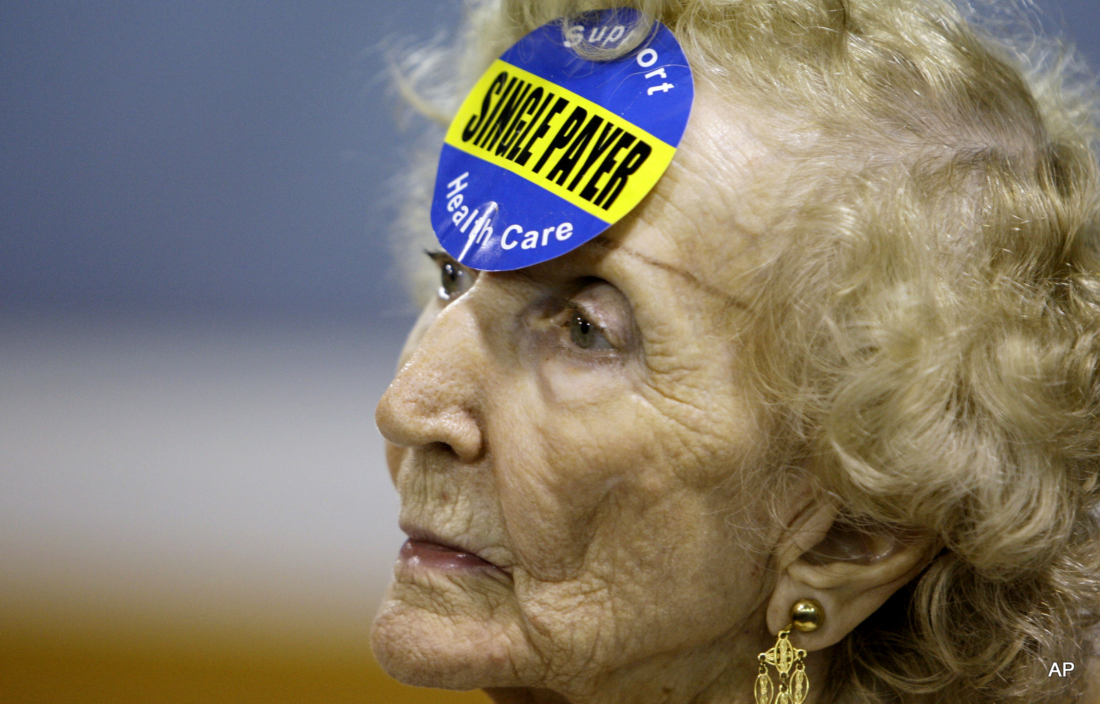 Roberta Crawford, 89, wears a sticker in support of single payer health care