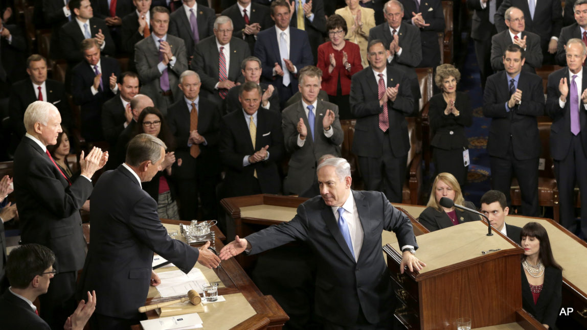 Benjamin Netanyahu reaches to shake hands with House Speaker John Boehner