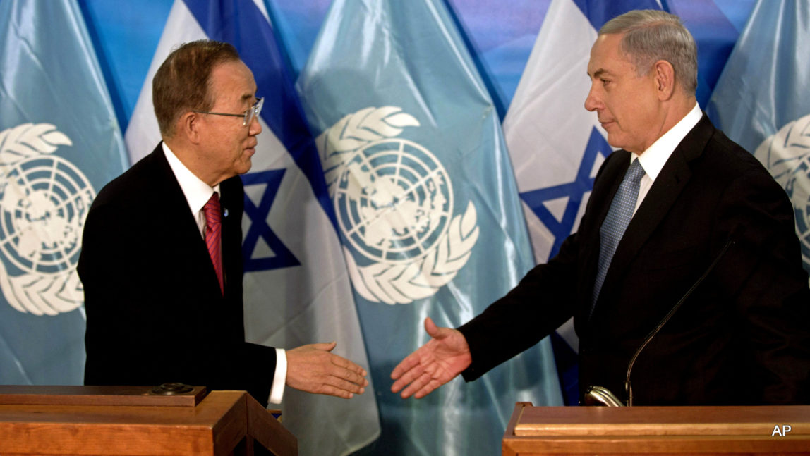 U.N. Secretary-General Ban Ki-Moon, left and Israeli Prime Minister Benjamin Netanyahu shake hands at a press conference