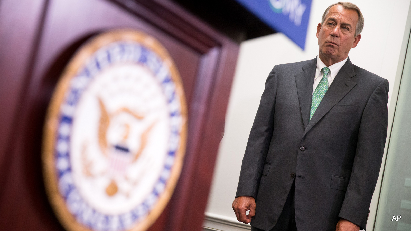 House Speaker John Boehner of Ohio listens during a news conference on Capitol Hill in Washington