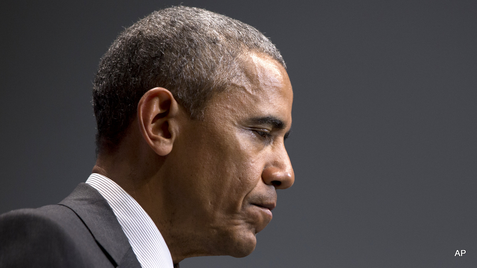 Barack Obama pauses as he speaks during a news conference at the G-7 summit