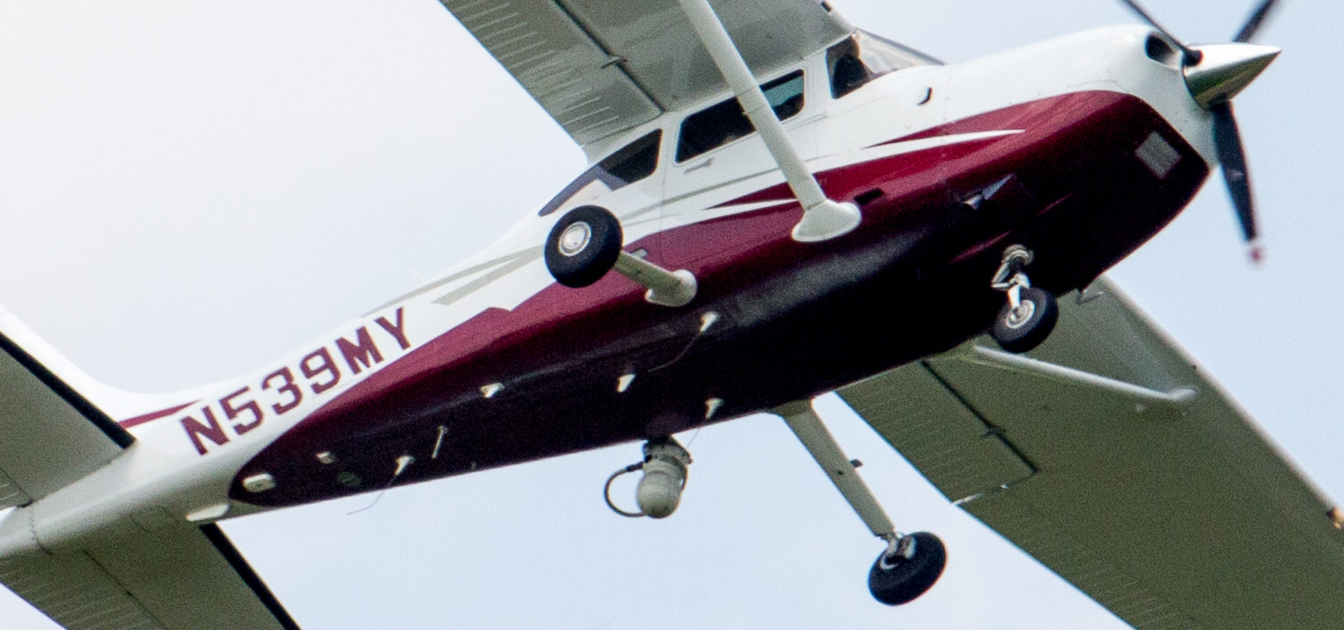 In this photo taken May 26, 2015, a small plane flies near Manassas Regional Airport in Manassas, Va. The plane is among a fleet of surveillance aircraft by the FBI, which are primarily used to target suspects under federal investigation. Such planes are capable of taking video of the ground, and some _ in rare occasions _ can sweep up certain identifying cellphone data. (AP Photo/Andrew Harnik)