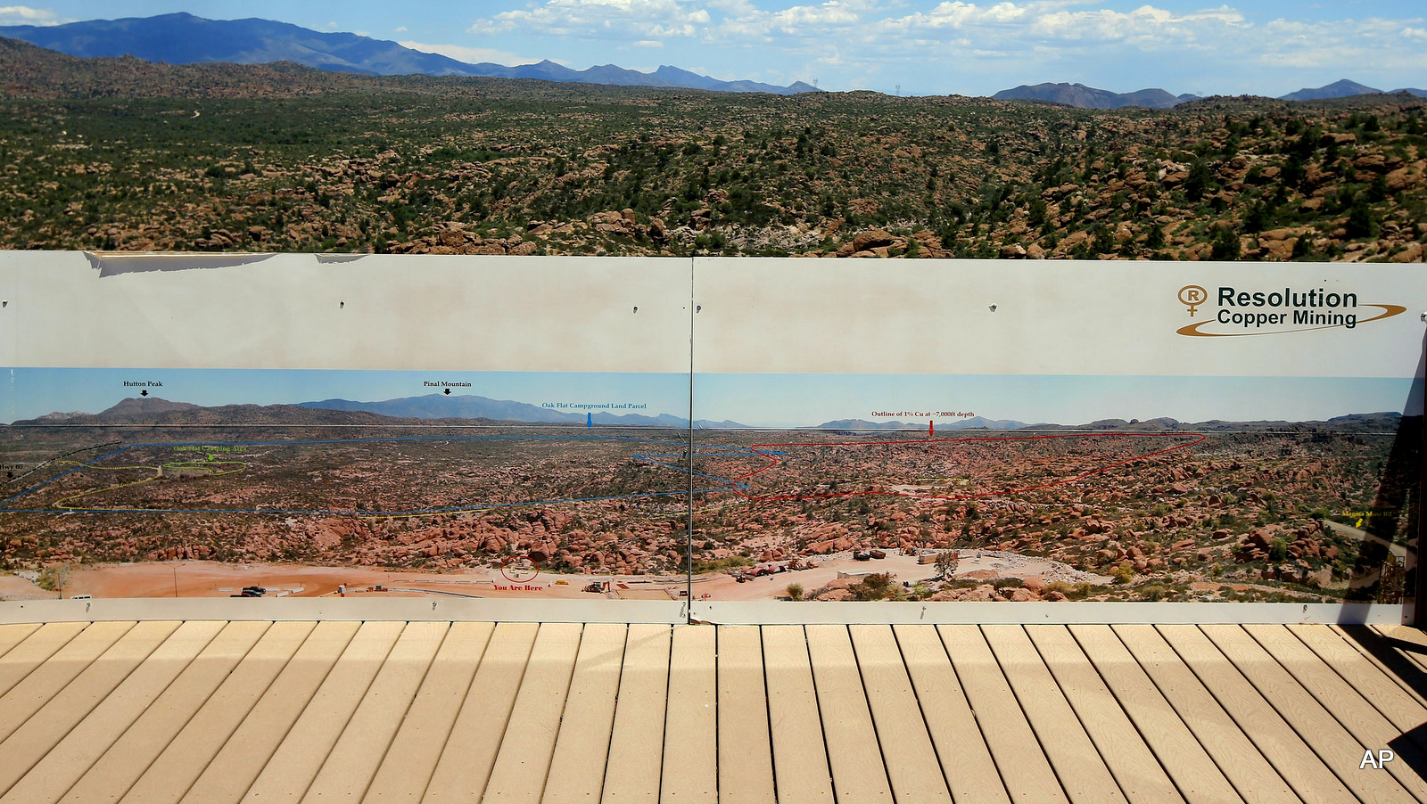 This photo taken Monday, June 15, 2015, shows in the distance part of the Resolution Copper Mining land-swap project in Superior, Ariz.  