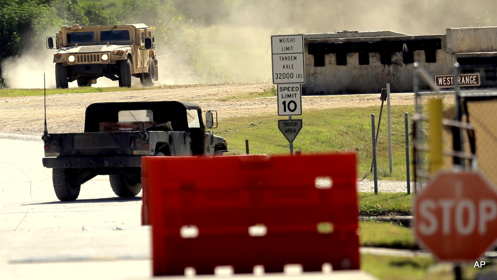 Military vehicles are seen at Texas Army National Guard Camp Swift, Wednesday, July 15, 2015, in Bastrop, Texas. Jade Helm 15, a summer military training exercise, that has aroused alarm among some Texans, begins Wednesday outside the Central Texas town of Bastrop. 