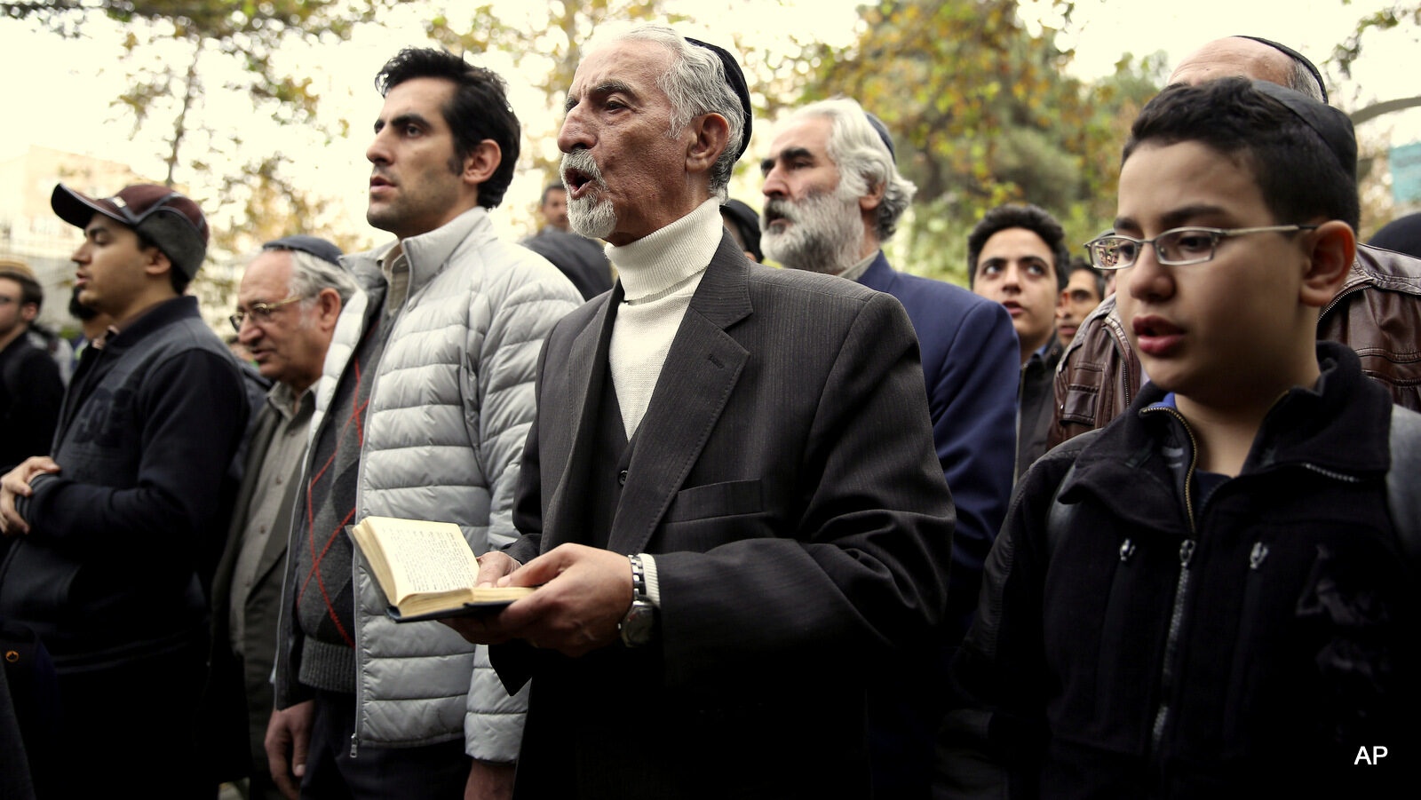 Iranian Jews pray in Hebrew during a gathering of Iran's Jewish community