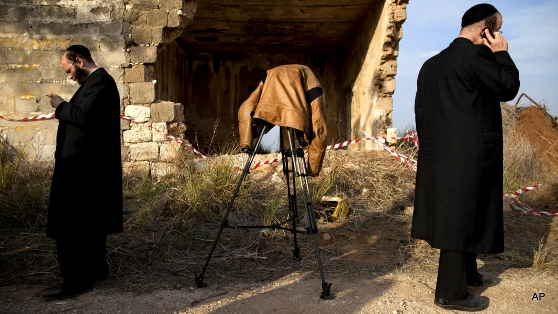 Israeli journalists are seen during a press conference near a military defense missile system near Tel Aviv, Sunday, Nov. 18, 2012.