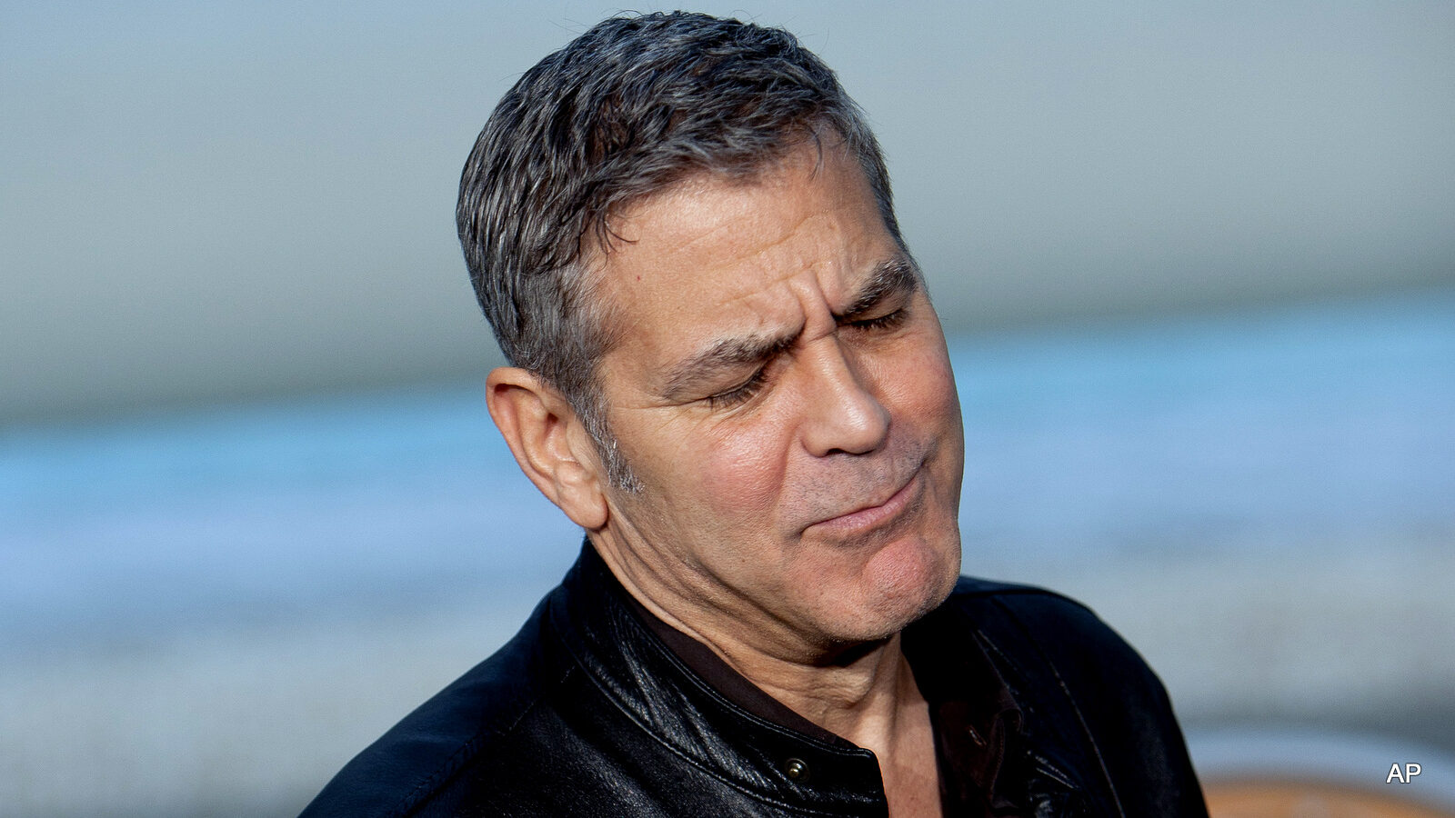 US actor George Clooney speaks with photographers and leaves the photocall during the premiere of the film 'Tomorrow Land' at Ciudad de las Artes y las Ciencias in Valencia, Spain on Tuesday, May 19, 2015.