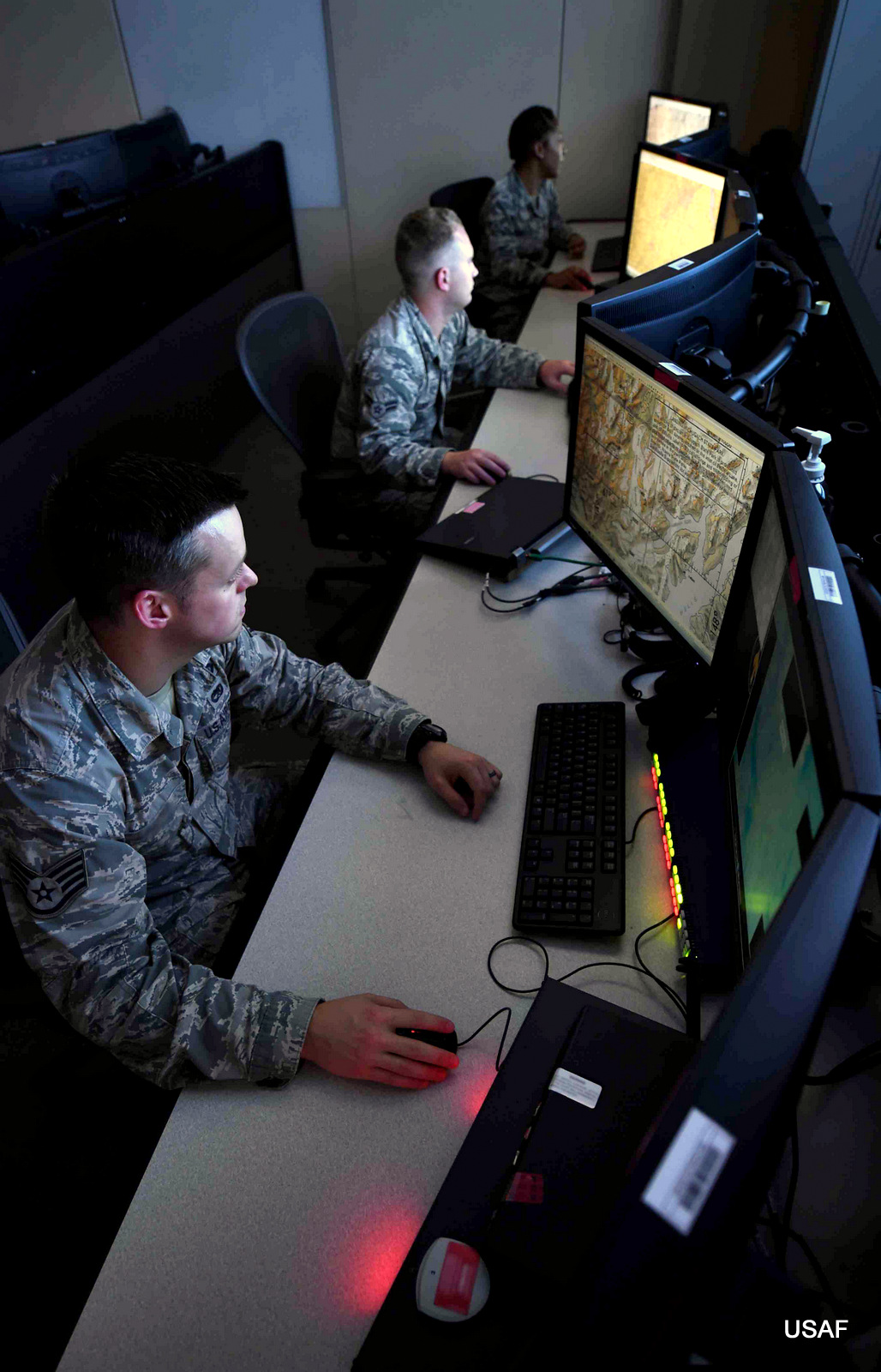 Analysts assigned to the 11th Intelligence Squadron review mission data