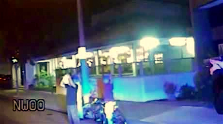 In this June 2, 2013, frame from Gardena Police Department dash-cam video, an officer, right, aims a gun at Ricardo Diaz-Zeferino, left, and two friends while investigating a bicycle theft in Gardena, Calif. Moments later police fatally shot Diaz-Zeferino. Hours after a federal judge ordered the release of videos sought by The Associated Press and other news organizations Tuesday, July 14, 2015, a federal appeals court has issued a stay blocking release of the video. (Gardena Police Department)