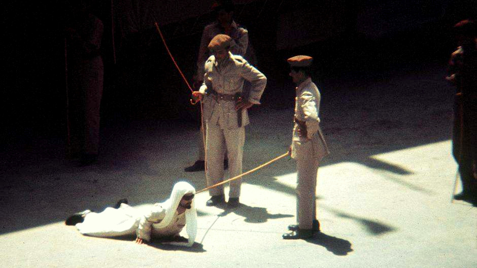 Saudi military personnel hone their corporal punishment skills with wooden canes.