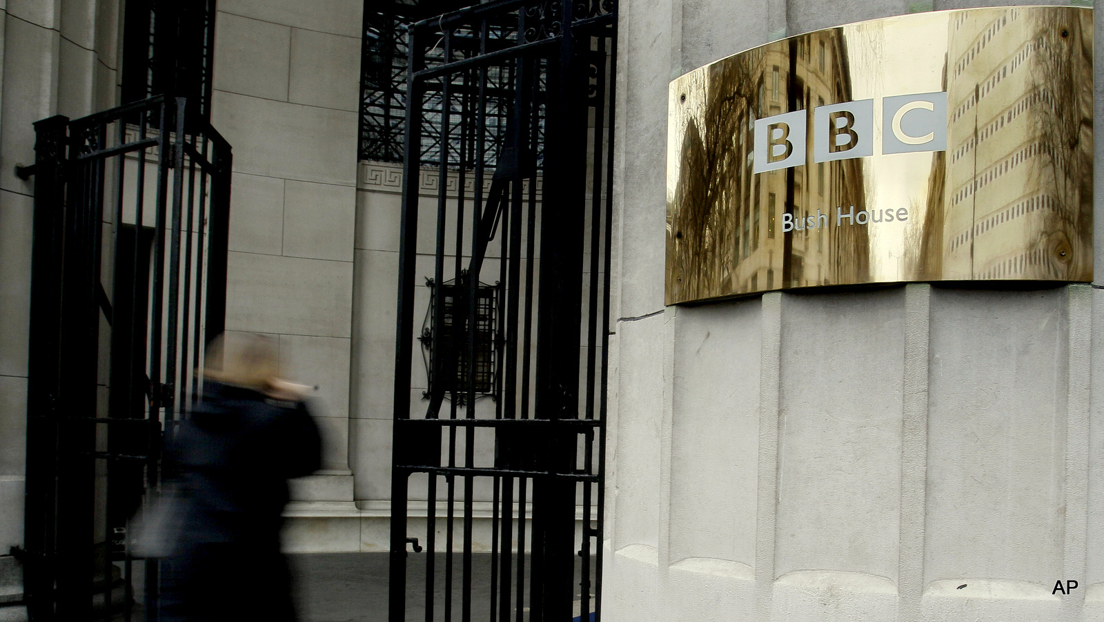 A pedestrian enters the BBC's Bush House in London.