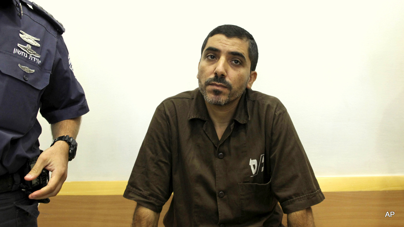 Palestinian engineer Dirar Abu Sisi, accused of masterminding Hamas' rocket program and training fighters in Gaza, attends a court session in the southern Israeli town of Beersheba, Thursday, June 16, 2011. 