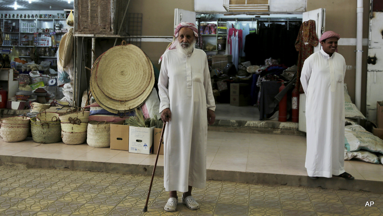 A Saudi merchant stands in front of stores in the old market in Najran, Saudi Arabia, where the local Sunni tribes, inspired by the Houthis of Yemen, have declared the rule of Saudi King Salman as illegitimate.
