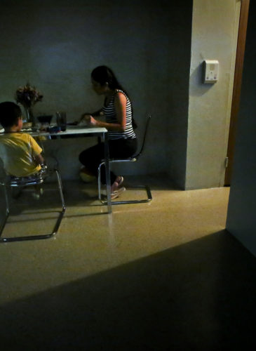 A women sits with her son for dinner in their new sparsely furnished apartment, Thursday, Aug. 13, 2015, in New York. After leaving her husband who beat her for years, she and her little boy spent the next three years homeless because she couldn’t afford New York City rents. About one third of American children are now living in poverty. (AP Photo/Bebeto Matthews)