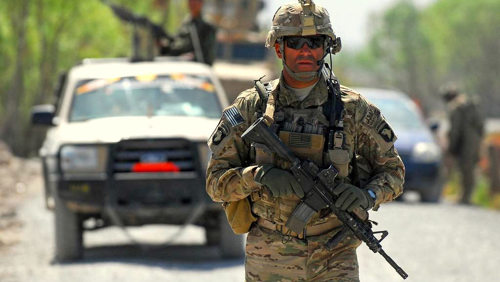 A U.S. Army soldier patrols near the village of Tarok Kolache where reconstruction efforts were underway, on Friday, April 1, 2011, in the Arghandab River Valley of Afghanistan. A new report on corruption in U.S. reconstruction efforts in Afghanistan shows widespread mismanagement of millions. (Flickr / ISAF Regional Command-South / Ensign Haraz Ghanbari)