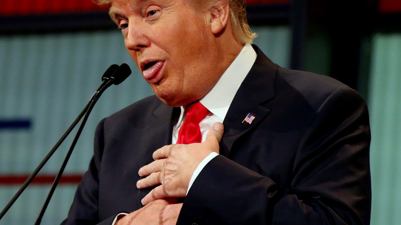 Republican presidential candidate Donald Trump responds to former Arkansas Gov. Mike Huckabee's closing remarks during the first Republican presidential debate at the Quicken Loans Arena Thursday, Aug. 6, 2015, in Cleveland.