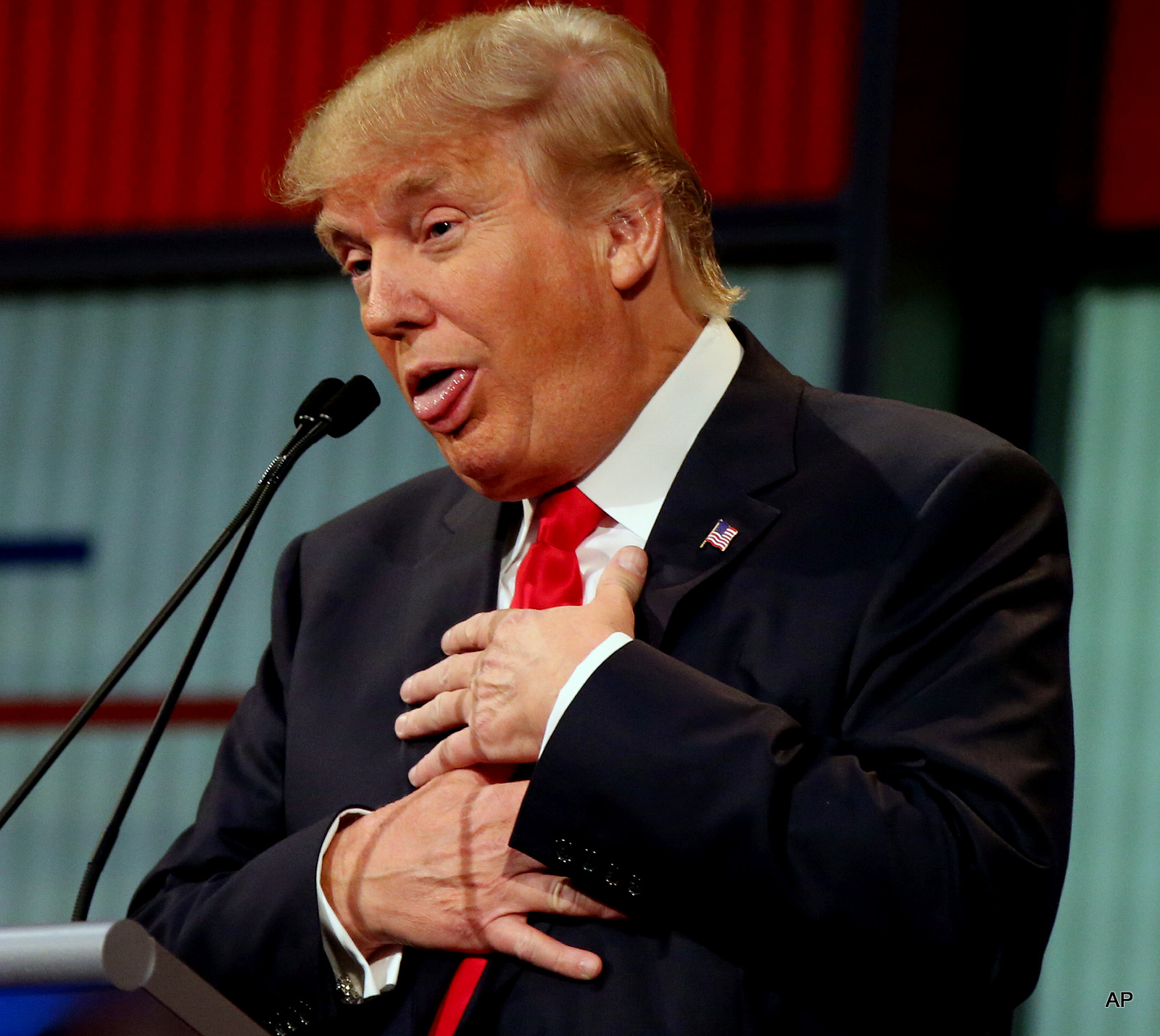 Republican presidential candidate Donald Trump responds to former Arkansas Gov. Mike Huckabee's closing remarks during the first Republican presidential debate at the Quicken Loans Arena Thursday, Aug. 6, 2015, in Cleveland.