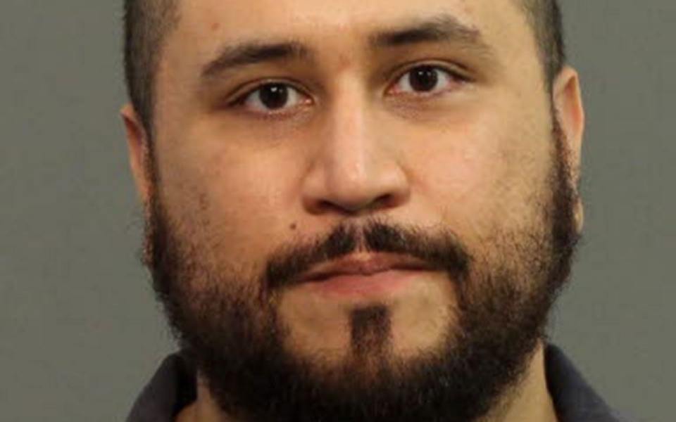 In this handout provided by Seminole County Sheriff`s Office, George Zimmerman poses for a processing photo after being arrested and booked into jail for threatening his girlfriend with a loaded shotgun.