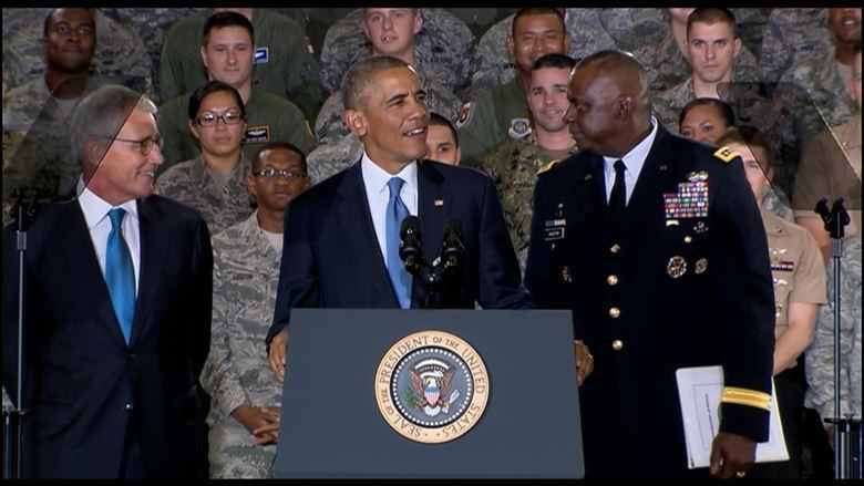 President Barack Obama is flanked by Defense Secretary Chuck Hagel and Army Gen. Lloyd J. Austin III, commander of U.S. Central Command, as he prepares to address troops at MacDill Air Force Base, Fla., Sept. 17, 2014. DoD photo from video