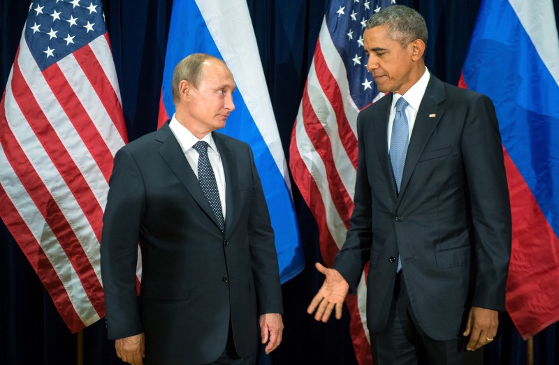 U.S. President Barack Obama, right, and Russia's President Vladimir Putin pose for members of the media before a bilateral meeting Monday, Sept. 28, 2015, at United Nations headquarters. (Sergey Guneyev/RIA-Novosti, Kremlin Pool Photo via AP)