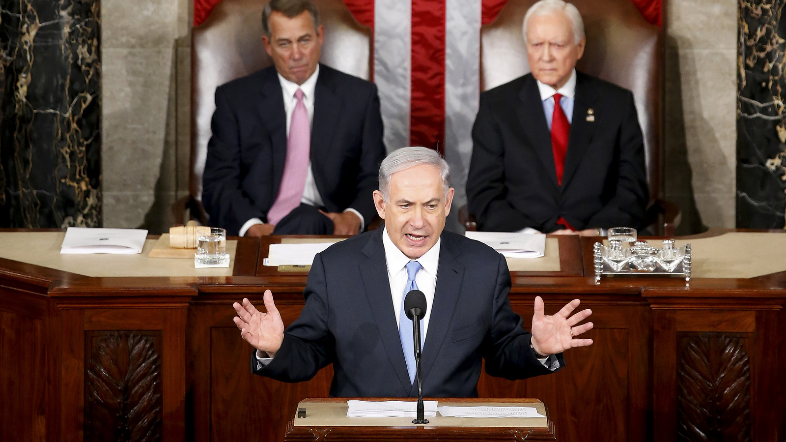 Israeli Prime Minister Benjamin Netanyahu speaks before a joint meeting of Congress on Capitol Hill in Washington, Tuesday, March 3, 2015. Netanyahu is using the address to warn against trusting Iran to curb its nuclear ambitions. House Speaker John Boehner of Ohio, left, and Sen. Orrin Hatch, R-Utah, listen. (AP Photo/Andrew Harnik)