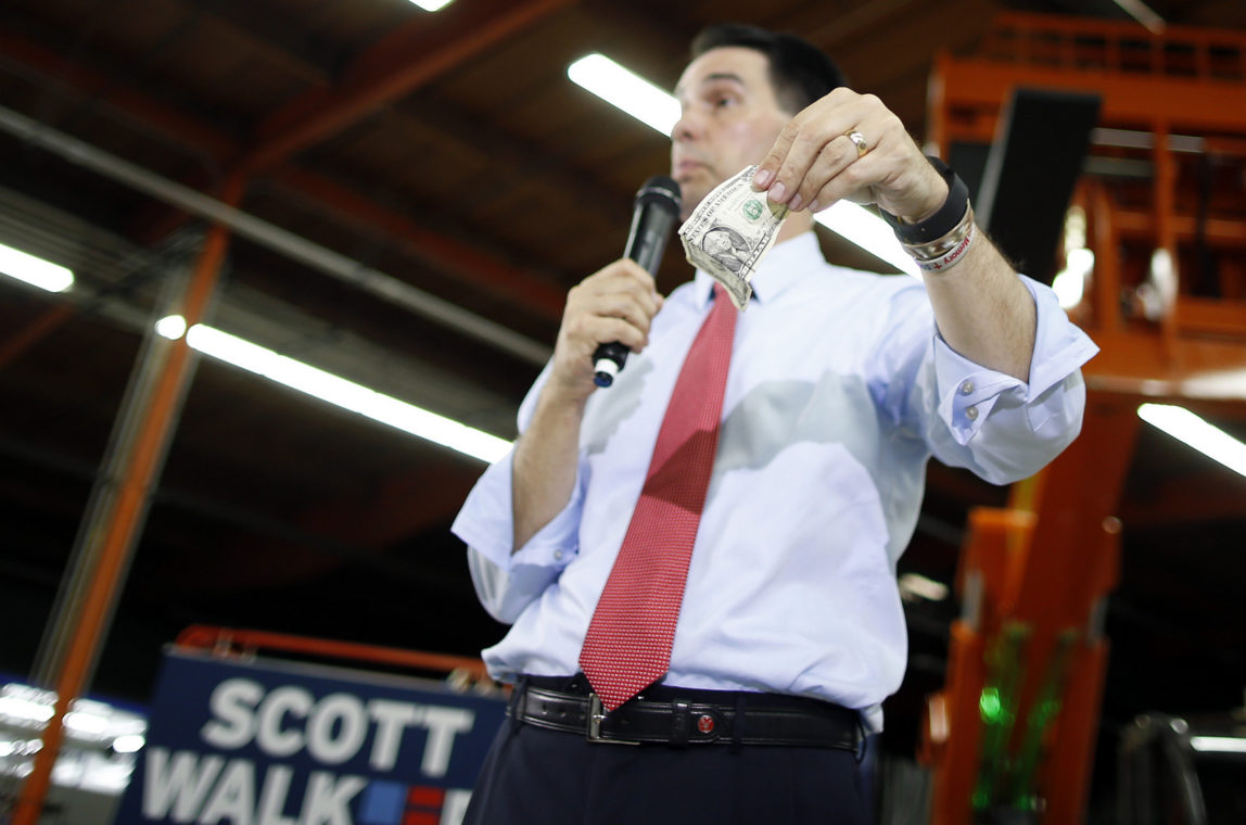 Republican presidential candidate Wisconsin Gov. Scott Walker speaks during a town hall meeting Monday, Sept. 14, 2015, in Las Vegas. (AP Photo/Isaac Brekken)