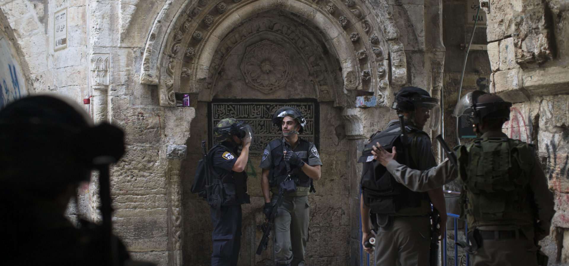 Israeli border police officers stand during clashes with Palestinian protesters in Jerusalem's old city, Tuesday, Sept. 15, 2015, in a third straight day of unrest at Jerusalem's most sensitive holy site. (AP Photo)