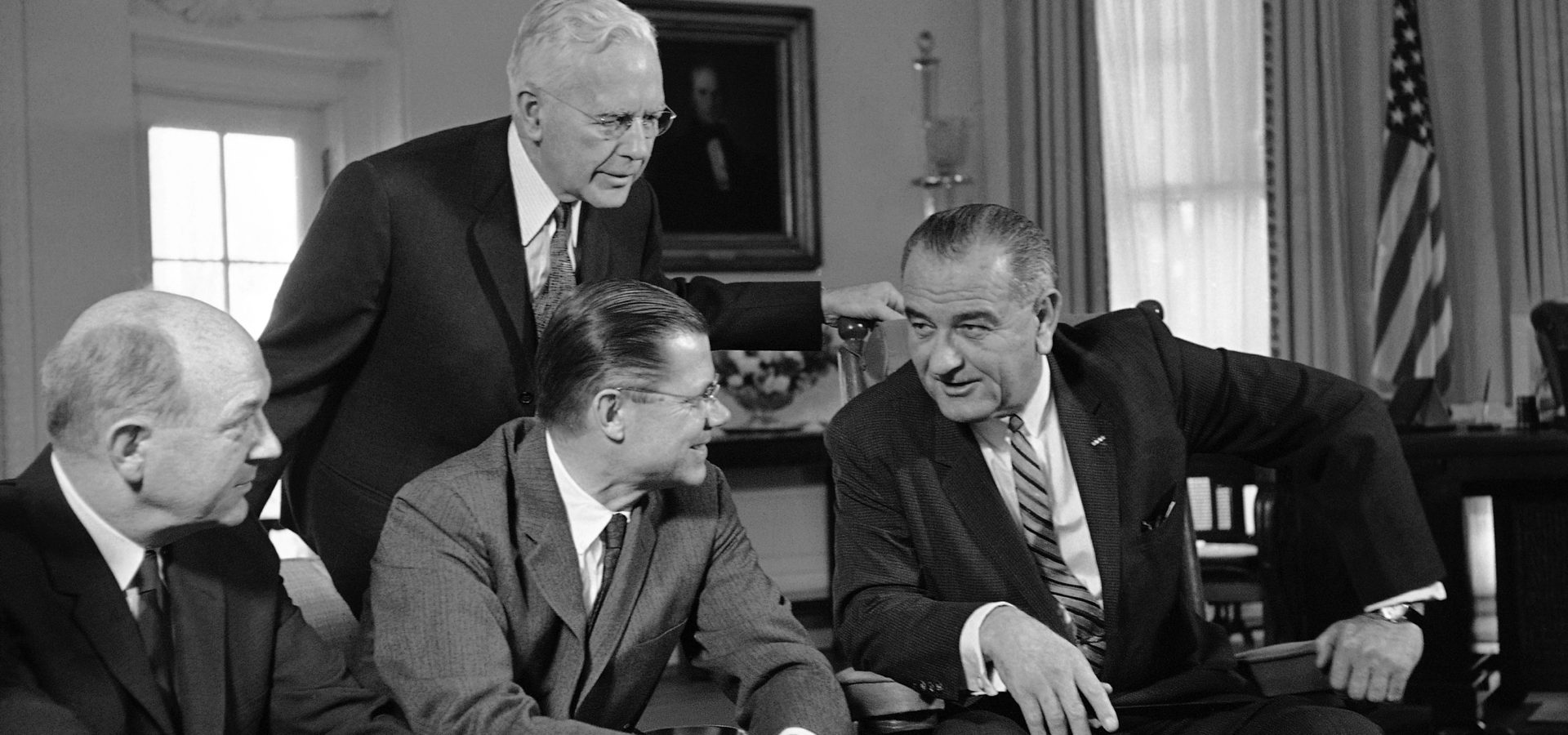 In this March 13, 1964 file photo, President Lyndon Johnson, right, talks with Secretary of Defense Robert McNamara, center sitting, after McNamara returned from a fact-finding trip to South Vietnam, at the White House in Washington. Fifty years ago Sunday, Aug. 10, 2014, reacting to reports of a U.S. Navy encounter with enemy warships in the Gulf of Tonkin off Vietnam, reports long since discredited, Johnson signed a resolution passed overwhelmingly by Congress that historians call the crucial catalyst for deep American involvement in the Vietnam War. (AP Photo/File)