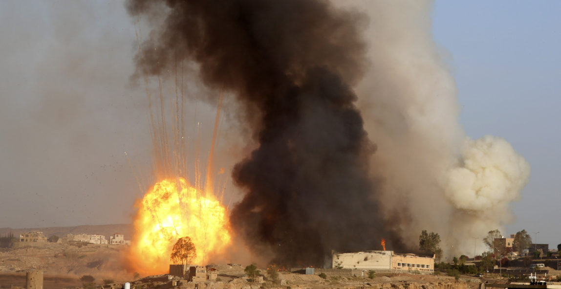 An explosion and smoke rise after an airstrike by the Saudi-led coalition in Sanaa, Yemen, Friday, Sept. 11, 2015. Saudi Arabia is leading a coalition of mainly Gulf nations fighting the Houthis, who seized the capital, Sanaa, last September. (AP Photo/Hani Mohammed)