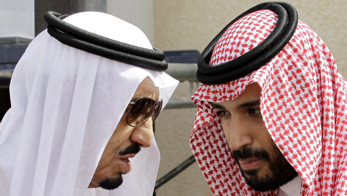 Saudi King Salman, left, speaks with his son Prince Mohammed bin Salman as they wait for Gulf Arab leaders ahead of the opening of a Gulf Cooperation Council summit, in Riyadh, Saudi Arabia. On Wednesday, April 29, 2015. (AP Photo/Hassan Ammar)