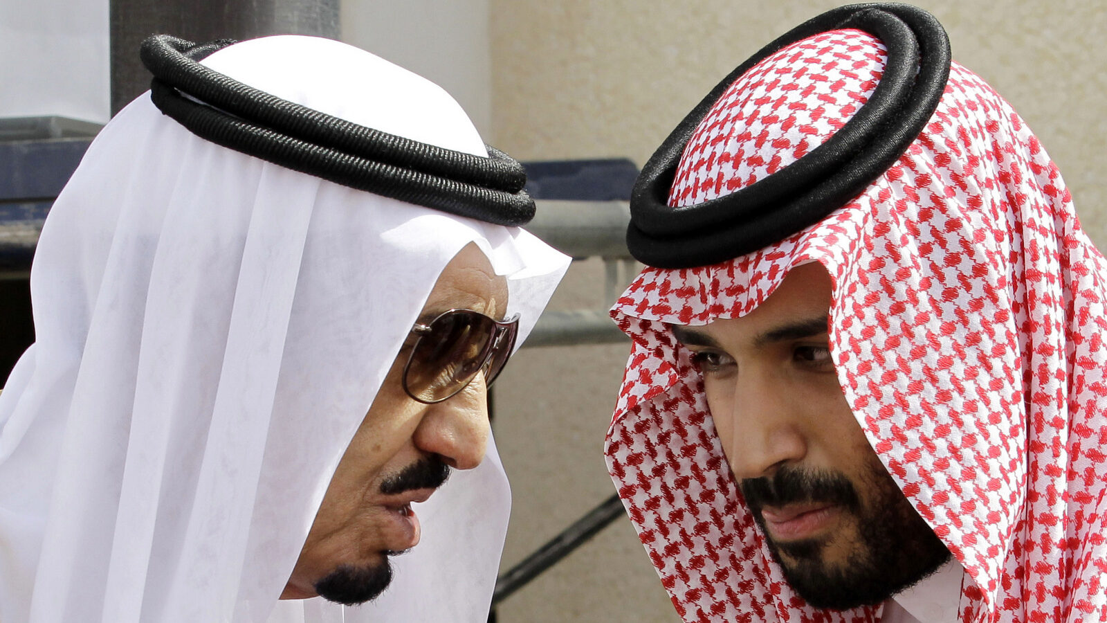 Saudi King Salman, left, speaks with his son Prince Mohammed bin Salman as they wait for Gulf Arab leaders ahead of the opening of a Gulf Cooperation Council summit, in Riyadh, Saudi Arabia. On Wednesday, April 29, 2015. (AP Photo/Hassan Ammar)