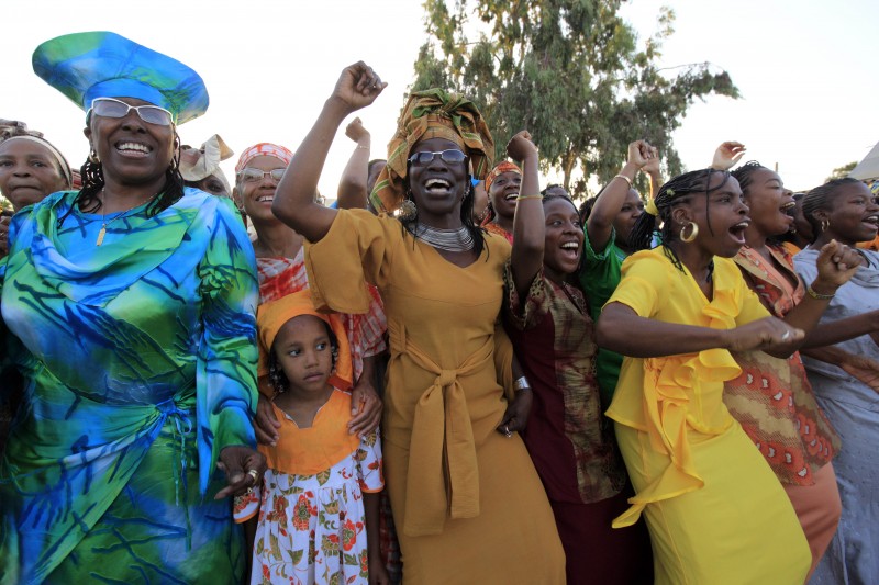 Members of the African Hebrew Israelites of Jerusalem dance during festivities marking the holiday of Shavuot in the southern Israeli town of Dimona, Sunday May 30, 2010. About 2,500 Hebrew Israelites who are originally from the United States live in the southern Israeli town and are widely referred to as Black Hebrews. Black Hebrews follow many of the practices of mainstream Judaism. (AP Photo / Tsafrir Abayov)