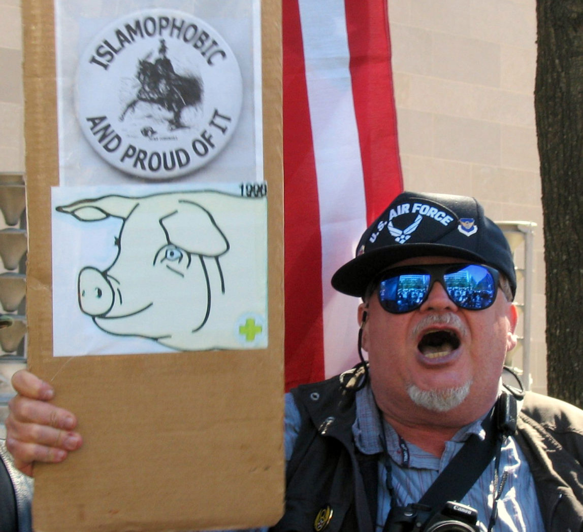 An American protester in Washington, D.C. holding a sign saying he's Islamophobic.