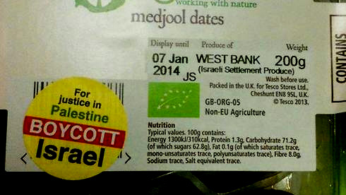 Israeli dates in a grocery store marked with the yellow boycott stickers.