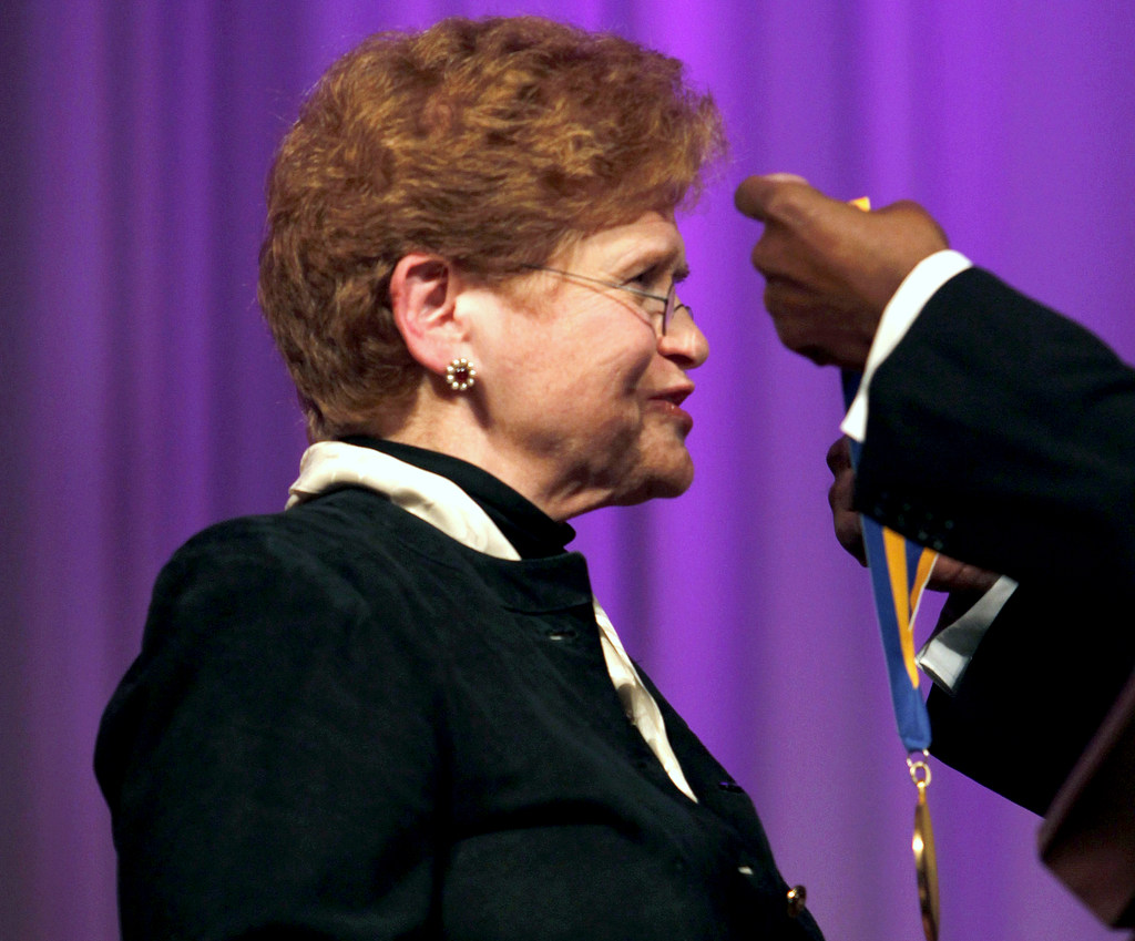 Dr. Deborah Lipstadt, left, receives the 2010 James Weldon Johnson medal from Dr. Rudolph Byrd, out of frame at right, during a ceremony at the Carter Center Monday, Nov. 8, 2010 in Atlanta. (AP Photo/David Goldman)